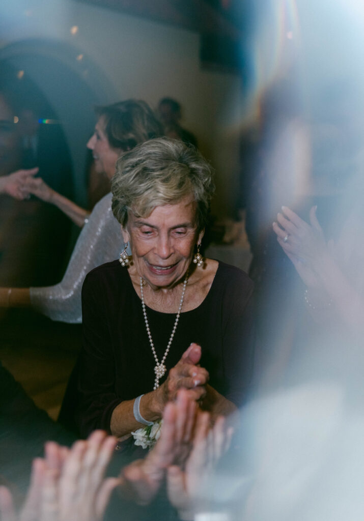 Wedding guests dancing at reception